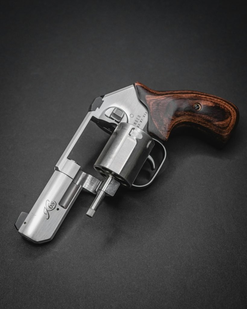 a-silver-revolver-with-a-wooden-handle-zg4owgf-org